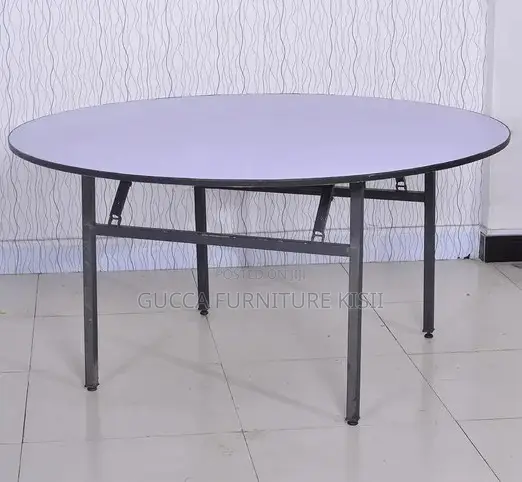 Round Foldable Table With Foldable Metallic Legs.