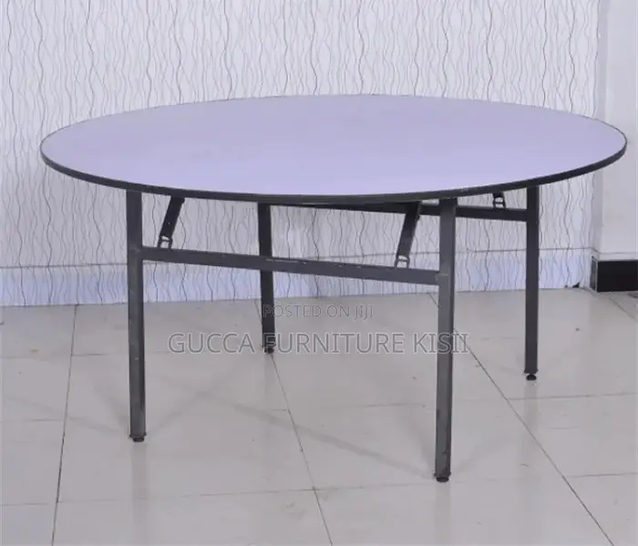 Round Foldable Table With Foldable Metallic Legs.