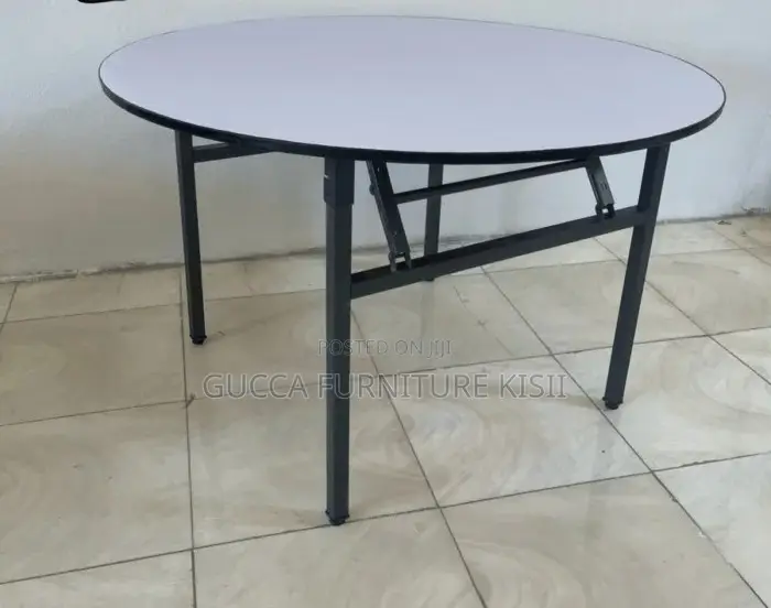 Round Foldable Table With Foldable Metallic Legs.