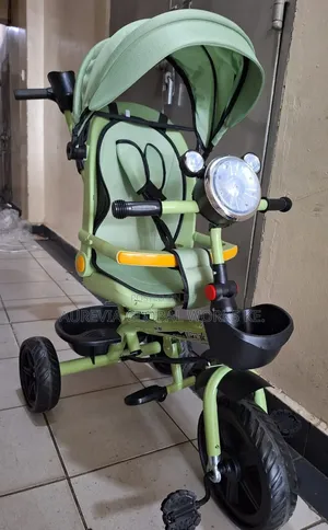 *Multi-Function Children's Tricycle Stroller With a Swivel Seat