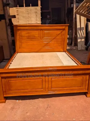 5 by 6 Brown Wooden Bed
