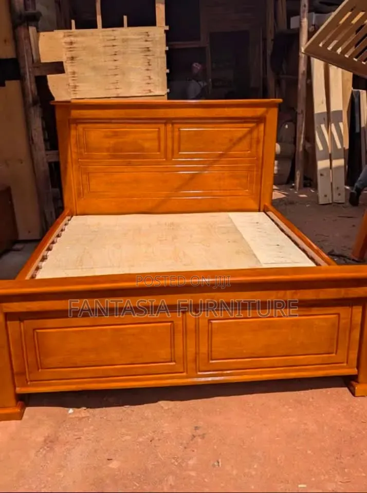 5 by 6 Brown Wooden Bed