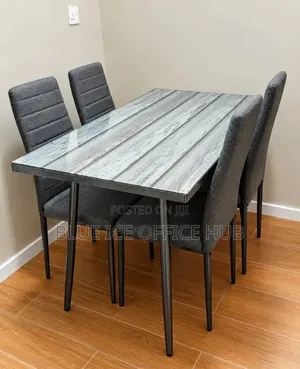 Modern 4-Seater Dining Table Set With Grey Chairs.
