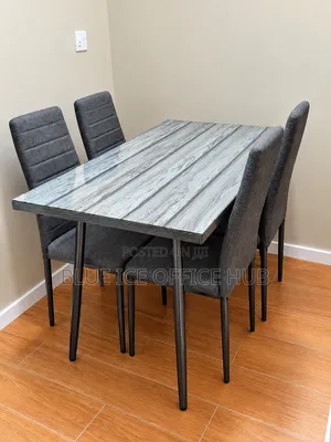 Modern 4-Seater Dining Table Set With Grey Chairs.