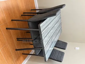Modern 4-Seater Dining Table Set With Grey Chairs.