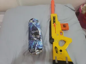 Toy Bundle Including Small Kids Skateboard and Display Nerf Gun