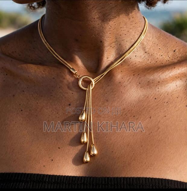 Gold Triple Chain Lariat Necklace With Teardrop Pendants -