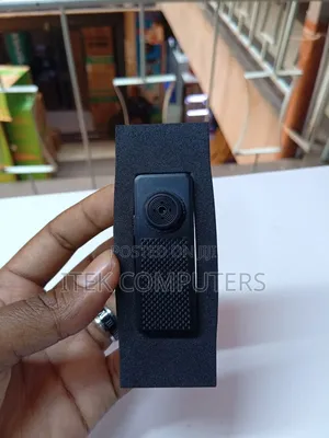 Small Button CCTV Camera for Authorized Workplace Security Monitoring.