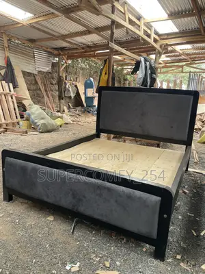 A Dark Grey Fabric, Black Frame Painted Mocket Bed