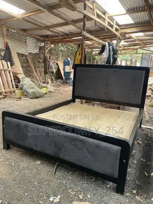 A Dark Grey Fabric, Black Frame Painted Mocket Bed