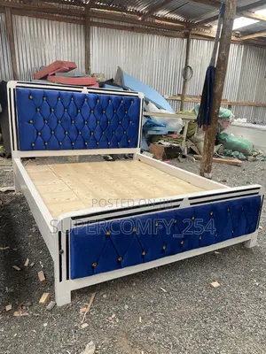 A Colourful Blue Fabric, White & Black Wooden Framed Mocket Bed