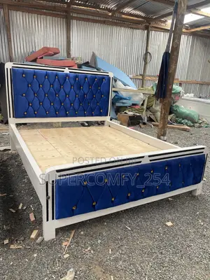 A Colourful Blue Fabric, White & Black Wooden Framed Mocket Bed