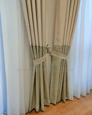 Blue Curtains and Gold Sheers With Rings