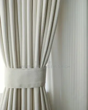 Light Blige Curtains and Off White With Hooks