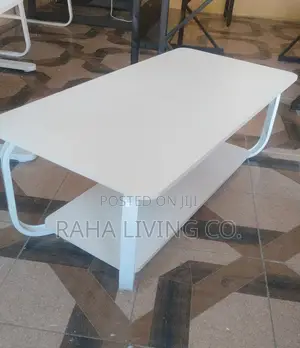 Modern White Coffee Table With Curved Legs and Lower Shelf
