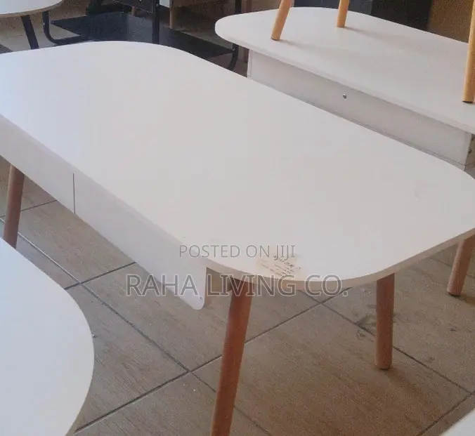 Modern White Oval Coffee Table With Drawers and Wooden Legs