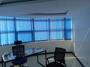 Contemporary Window Styling With Blue Vertical Blinds