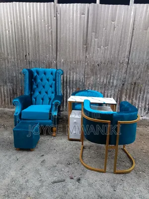 Assorted Pedicure and Manicure Seats and a Table 