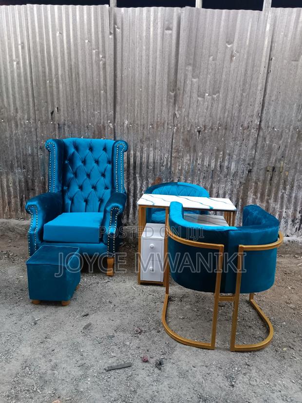 Assorted Pedicure and Manicure Seats and a Table - main view