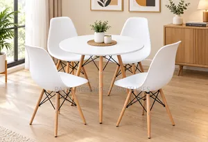 Round Dining Table With Four White Chairs