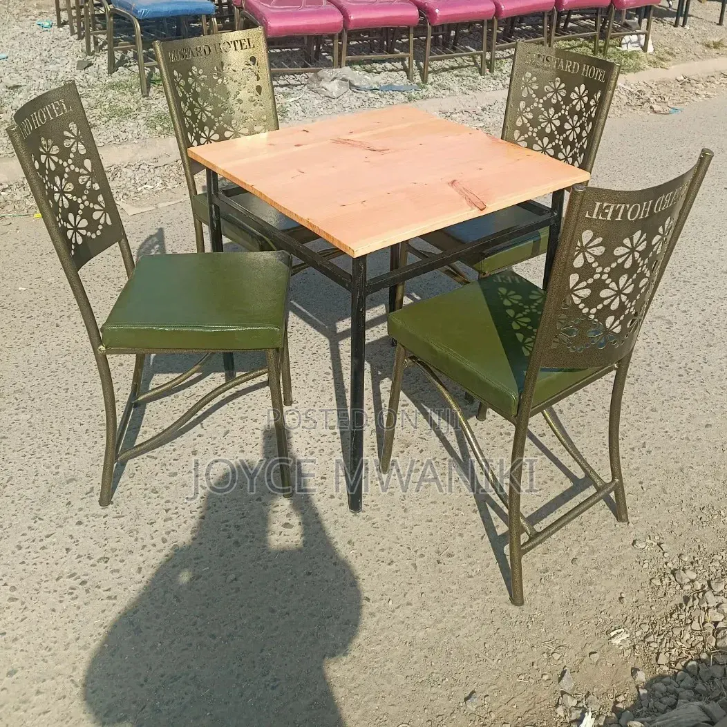 Restaurant Set With Green Padded Chairs and Coated Frame.