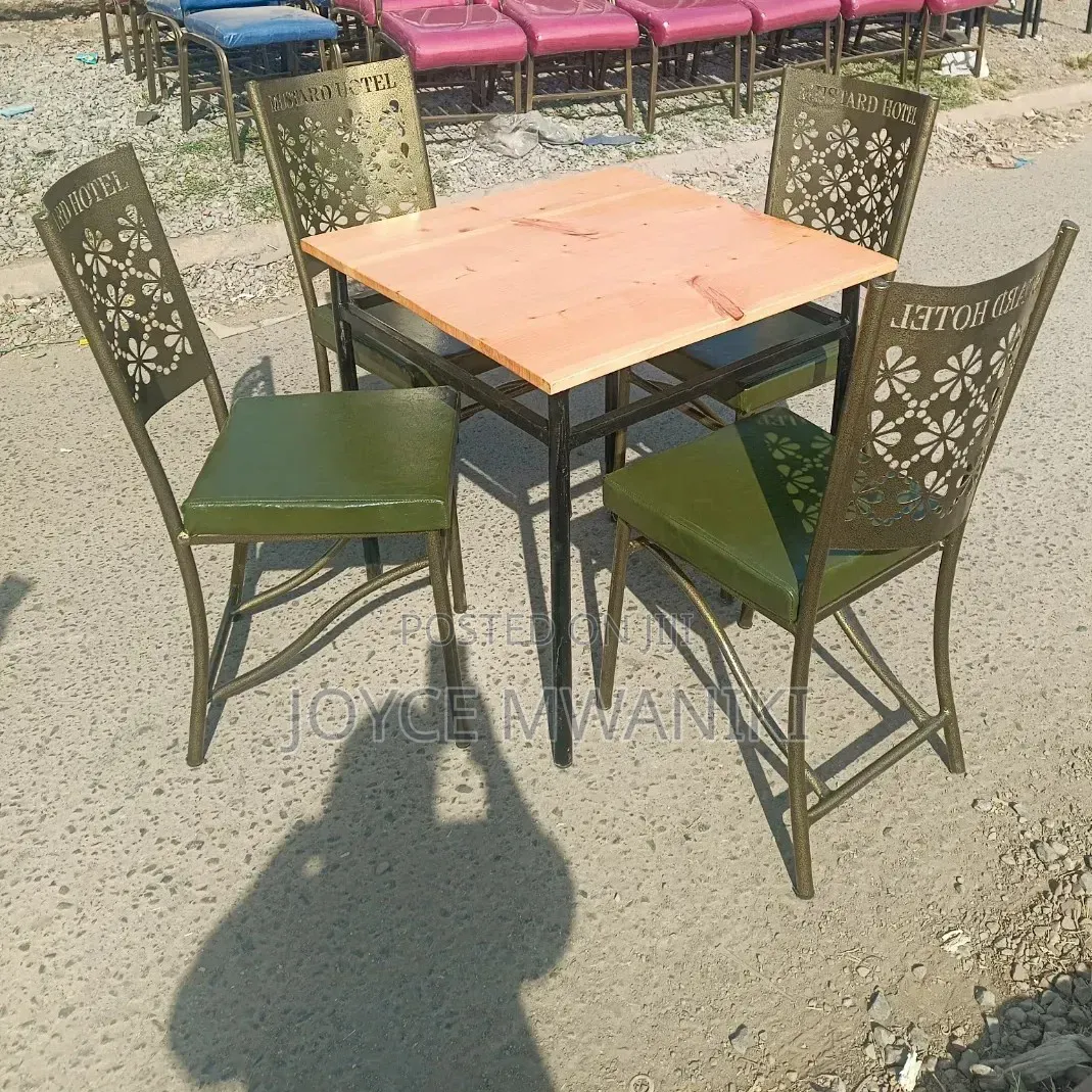 Restaurant Set With Green Padded Chairs and Coated Frame.