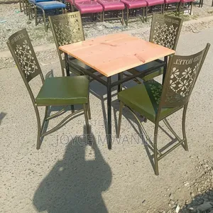 Restaurant Set With Green Padded Chairs and Coated Frame.