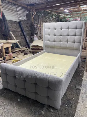 A Finely Tufted Chesterfield Queen Bed