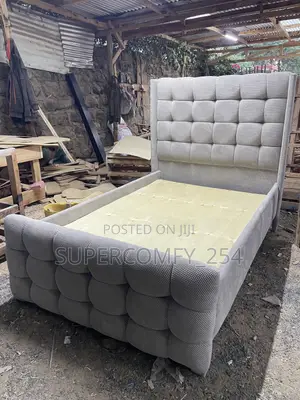 A Finely Tufted Chesterfield Queen Bed