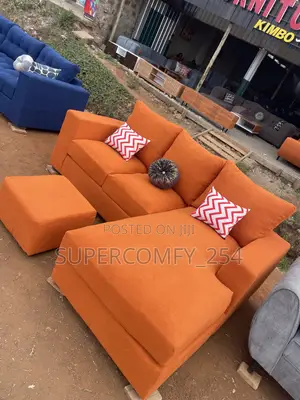 A Bright Orange Five Seater Cozy Corner Sofa