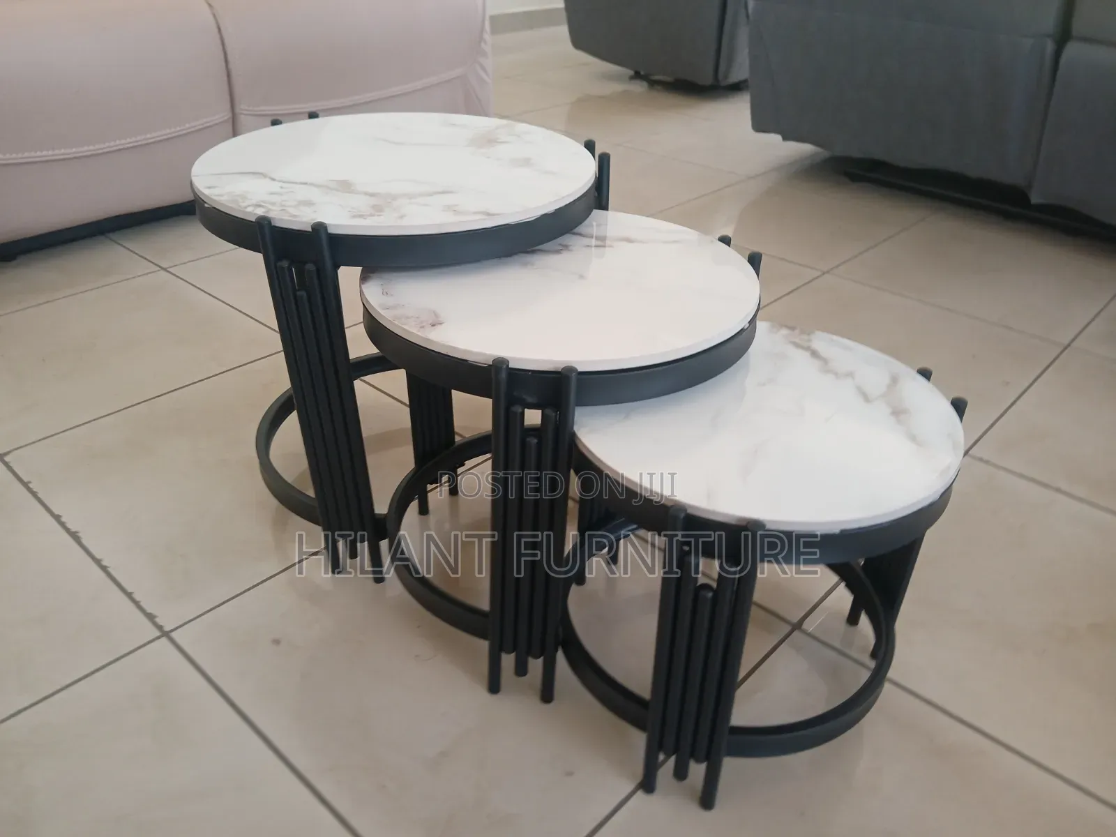 3 in 1 Round Marble Nesting Stools With Black Metallic Stands.