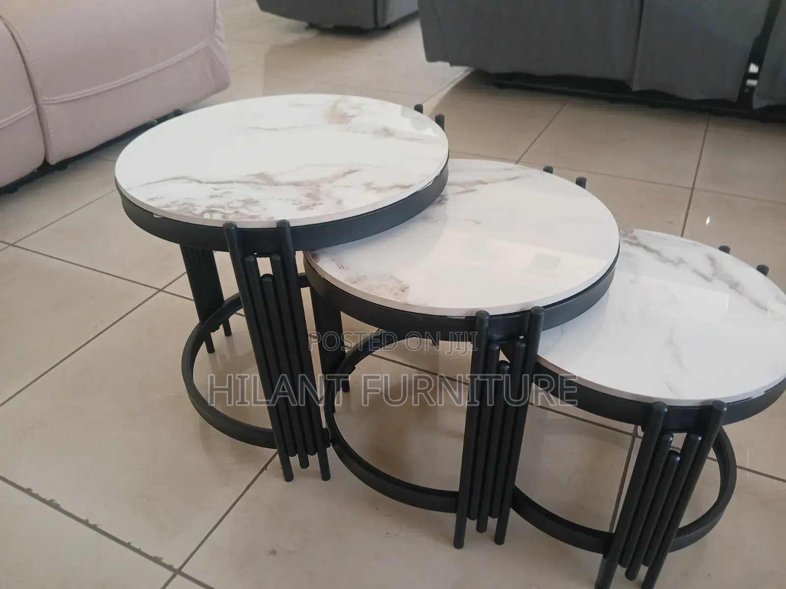 3 in 1 Round Marble Nesting Stools With Black Metallic Stands.