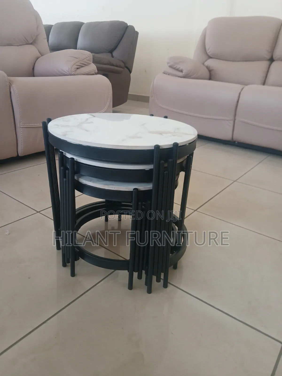 3 in 1 Round Marble Nesting Stools With Black Metallic Stands.