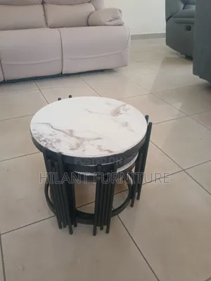 3 in 1 Round Marble Nesting Stools With Black Metallic Stands.