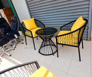 Outdoor 2-Seater Set With Yellow Cushions and Round Glass Table