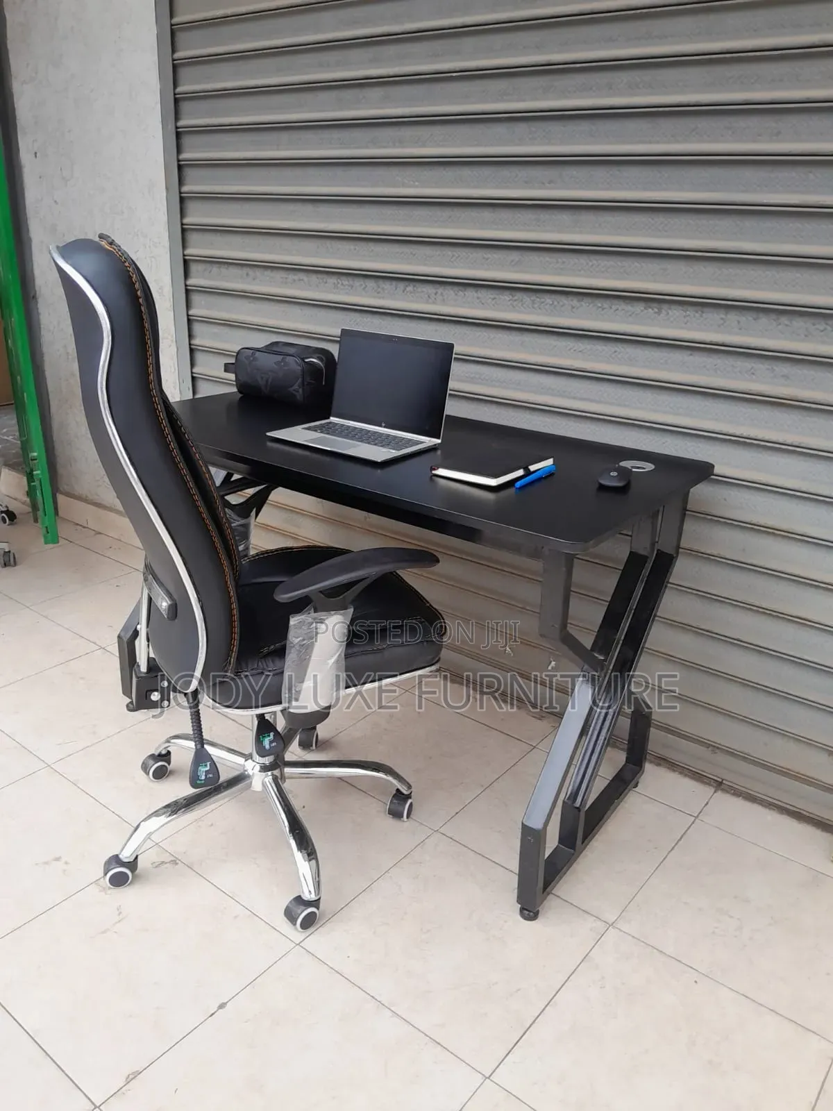 Black Leather Chair and White Chair and Desk