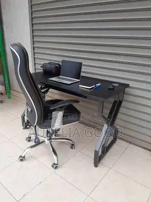 Black Leather Chair and White Chair and Desk