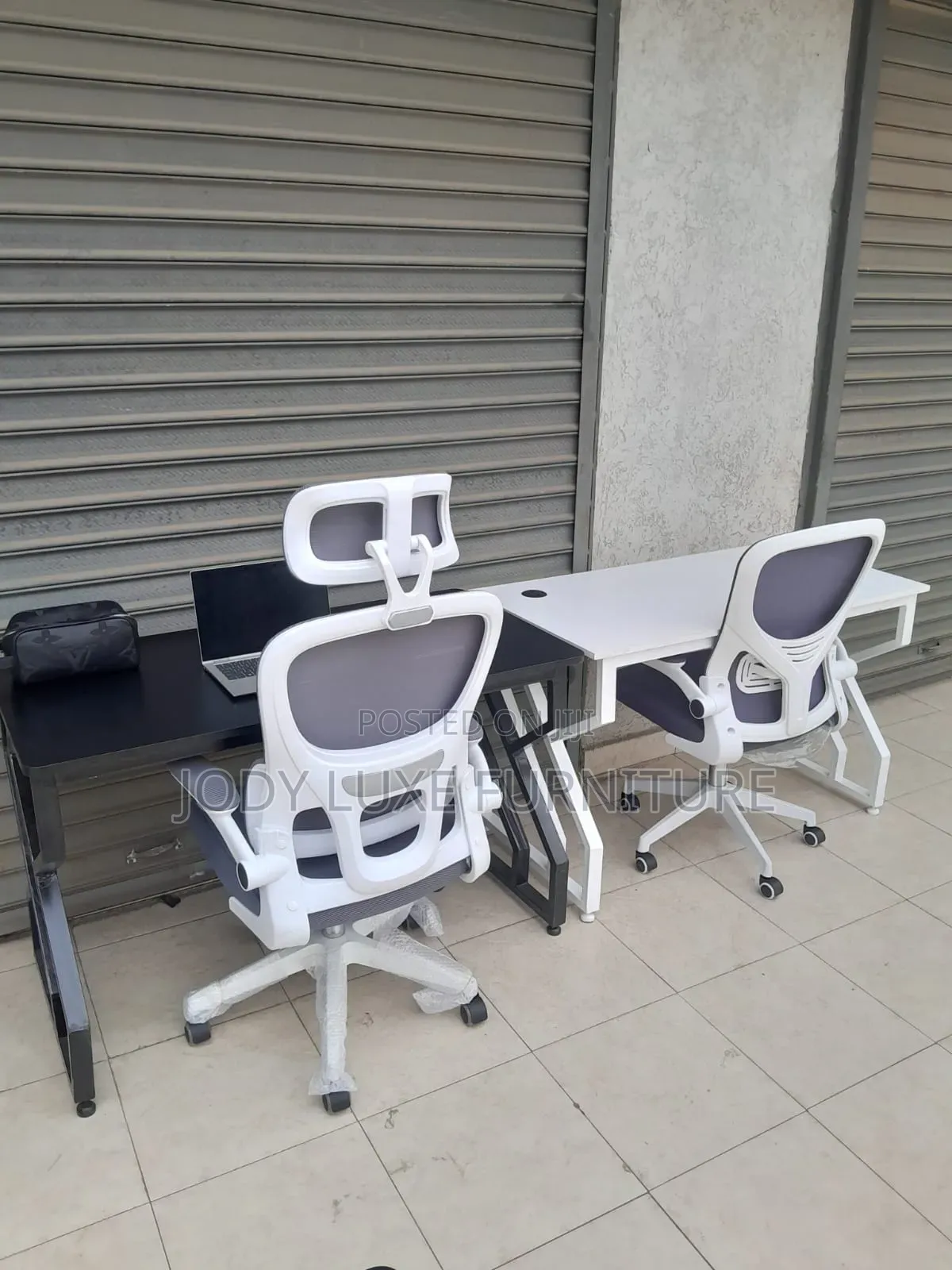 Black Leather Chair and White Chair and Desk