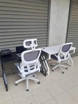 Black Leather Chair and White Chair and Desk