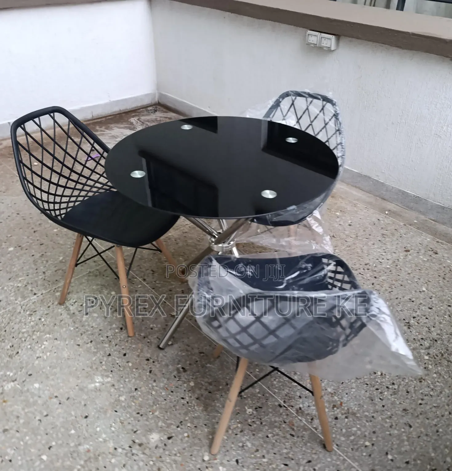 3 Seater Round Black Glass Top Table Set With Black Wire Eames Chairs