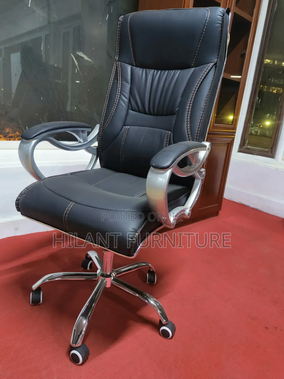 Executive High-Back Leather Office Chair With Chrome Armrests.