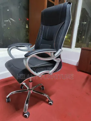 Executive High-Back Leather Office Chair With Chrome Armrests.