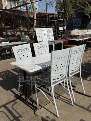 White Marble Table and Coated Restaurant Chairs