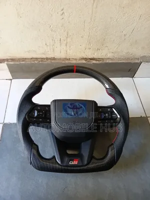• Premium Toyota GR Sport Carbon Fiber Steering Wheel