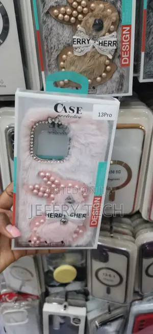 A Fluffy 3D Pearl Bunny Plush Phone Case a Soft Pink iPhone 13 Pro