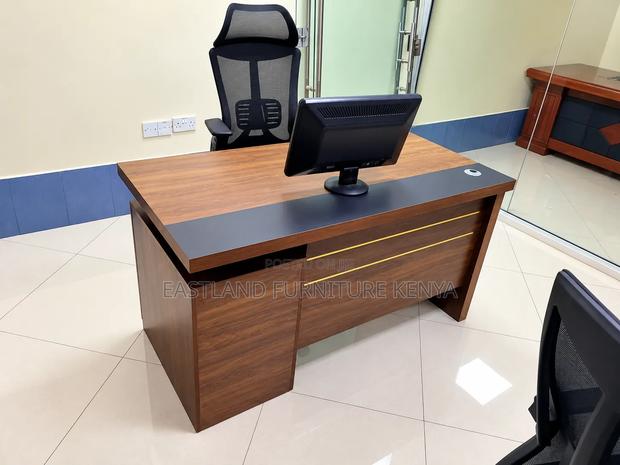 Modern Executive Office Desk With Walnut Finish and Black Accent Panel - main view
