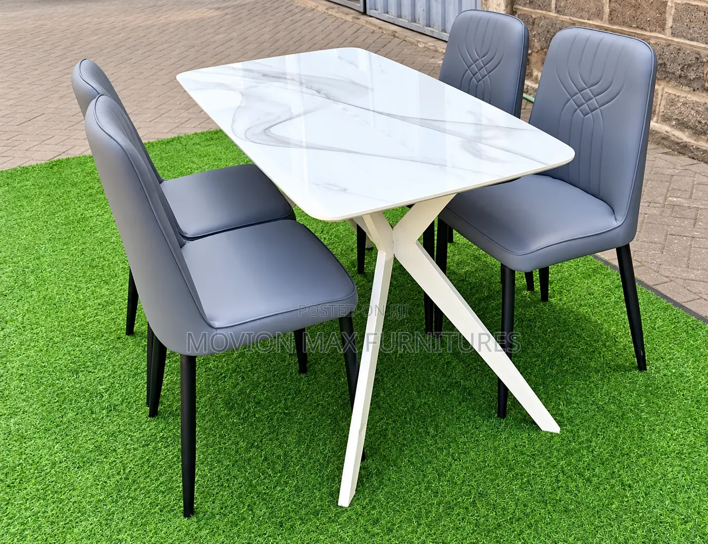 Modern White Marble Dining Table With 4 Grey Upholstered Dining Chairs