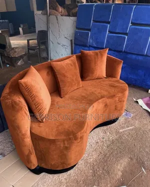 Brand New 3-Seater Curved Burnt Orange Velvet Couch With Pillows.