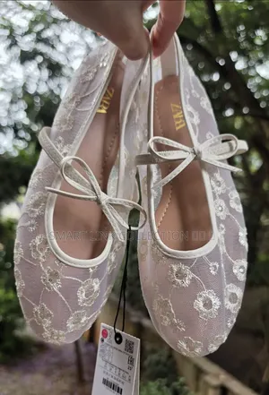 Floral Bow Tie Mesh Ballerina Flat.