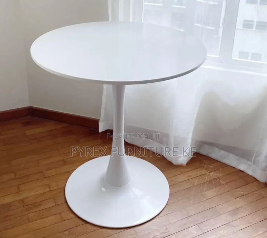 Minimalist Small Round Cafe Table With Single Stem Support